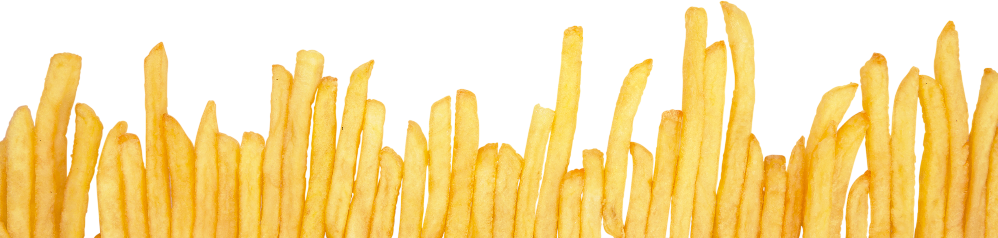 French Fries One beside the Other Close-up - Isolated